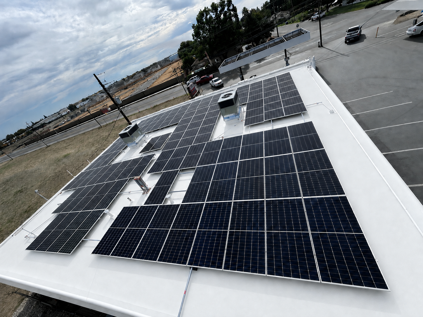 Aerial view of commercial building with solar panels